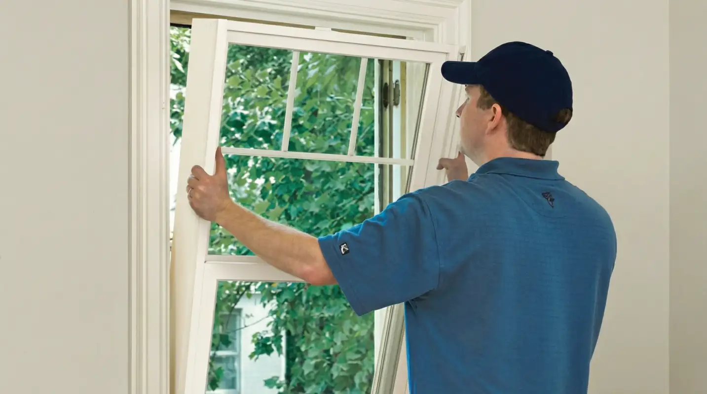 Professional contractors performing a residential window insulation and replacement service in Shreveport, LA